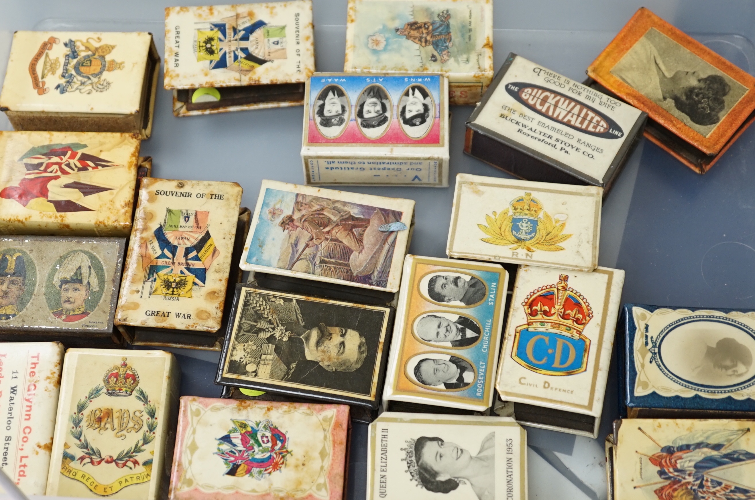A collection of early and mid 20th century WWII match box holders